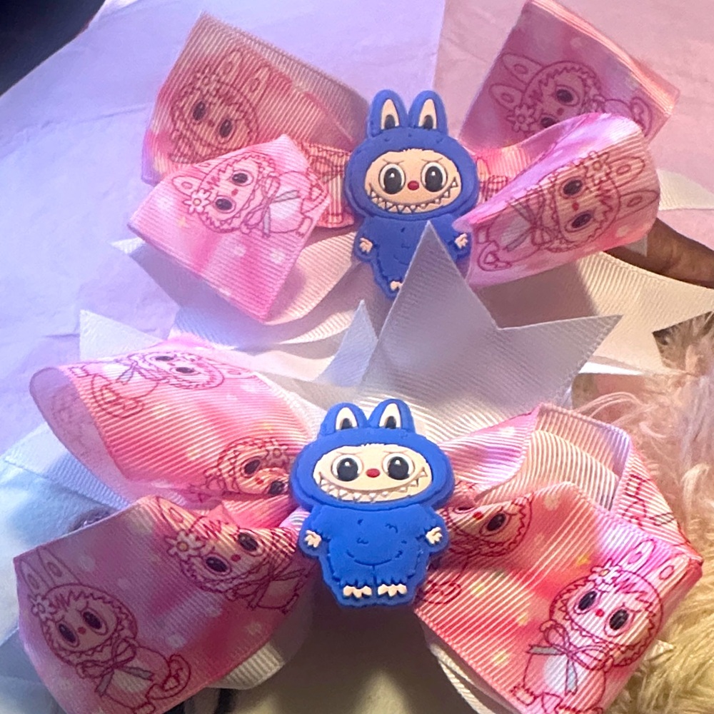 2 Pink and White Hair Bows with Blue Character